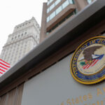 The seal of the United States Department of Justice is seen on the building exterior of the United States Attorney’s Office of the Southern District of New York in Manhattan, New York City